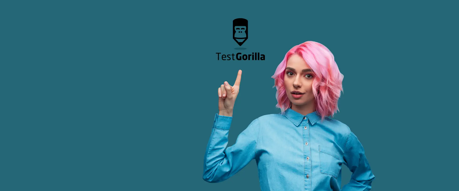 A woman pointing at the TestGorilla logo.